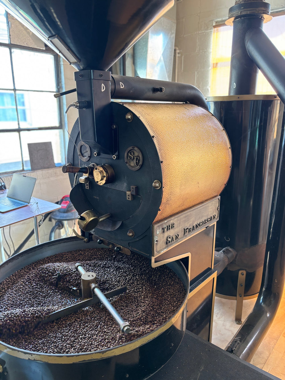 Coffee bag on linen, side light, dust motes.